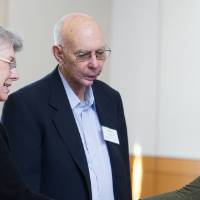 A student shaking the hands of her donors.